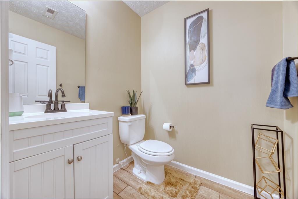 43 Ottawa Trail Fort Mitchell, AL 36856 - Photo 11 of 57 a bathroom with a sink a toilet and a mirror