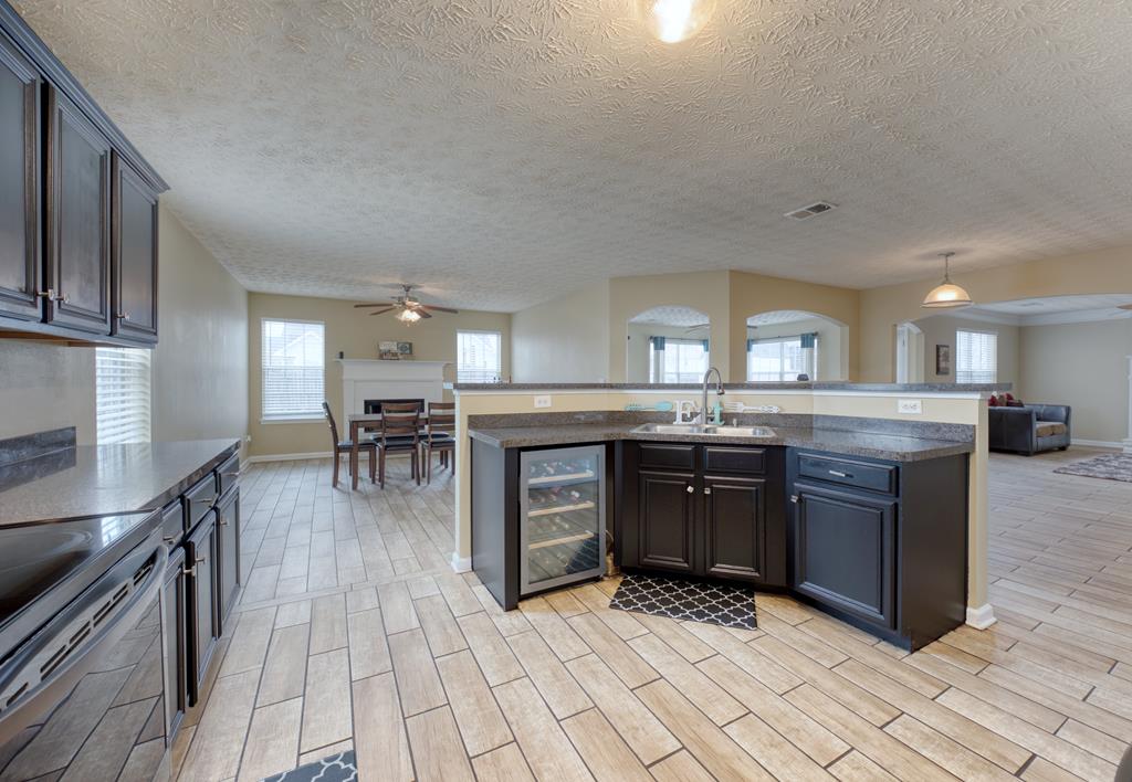 43 Ottawa Trail Fort Mitchell, AL 36856 - Photo 19 of 57 a kitchen with stainless steel appliances granite countertop a stove a sink dishwasher and a refrigerator