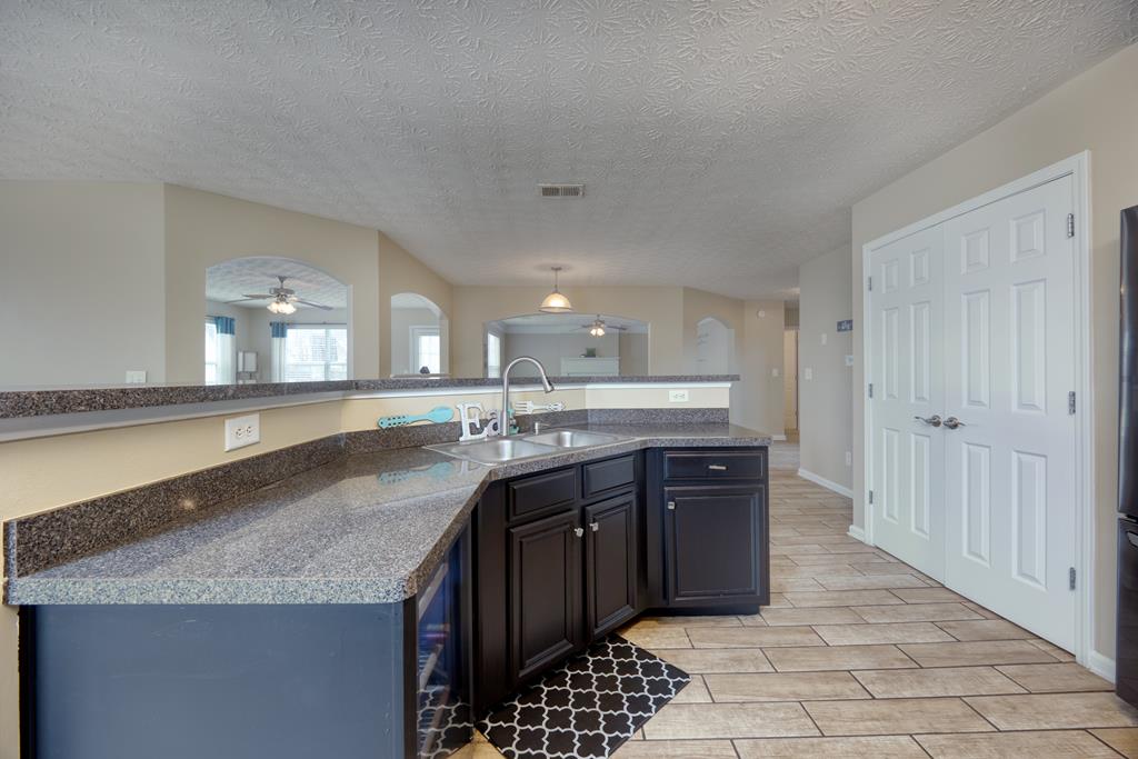43 Ottawa Trail Fort Mitchell, AL 36856 - Photo 20 of 57 a large kitchen with granite countertop a sink and cabinets