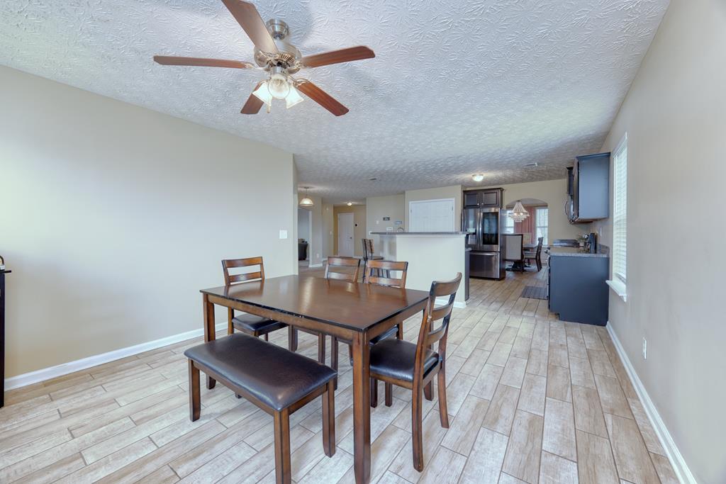 43 Ottawa Trail Fort Mitchell, AL 36856 - Photo 25 of 57 a view of a dining room with furniture and a wooden floor