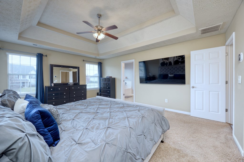 43 Ottawa Trail Fort Mitchell, AL 36856 - Photo 32 of 57 a large bedroom with a bed and a flat screen tv