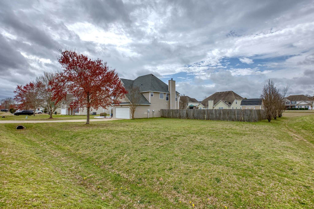 43 Ottawa Trail Fort Mitchell, AL 36856 - Photo 4 of 57 a house view with swimming pool and trees in the background