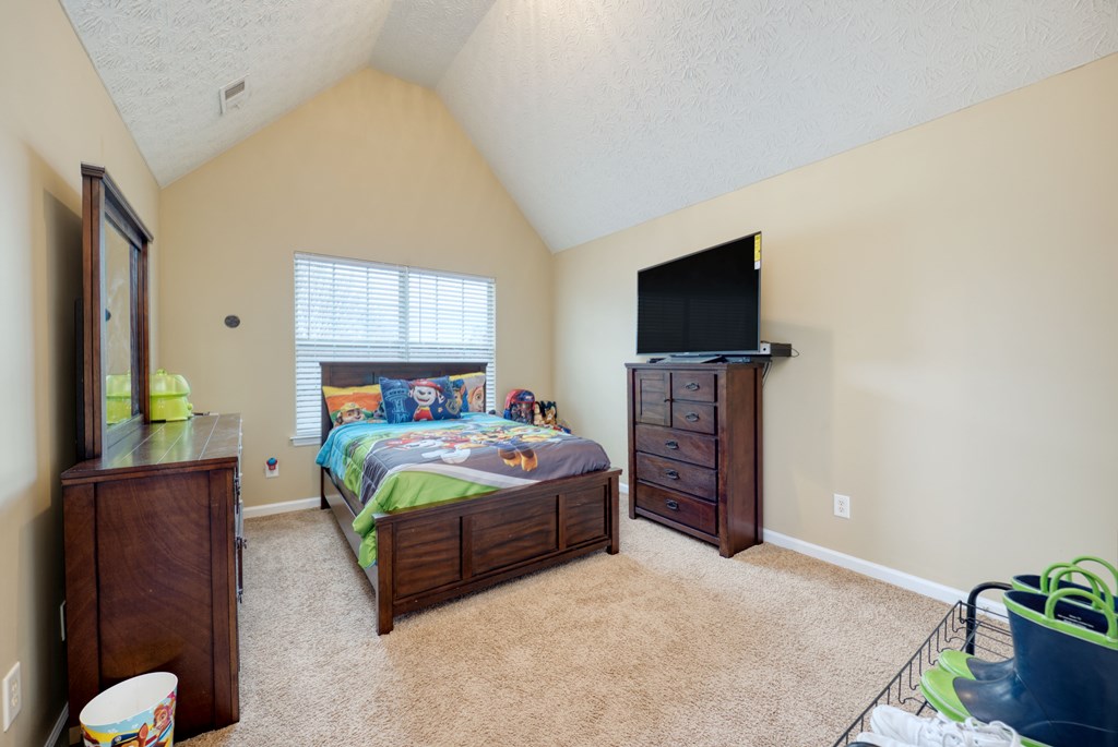 43 Ottawa Trail Fort Mitchell, AL 36856 - Photo 42 of 57 a bedroom with a bed and a flat screen tv