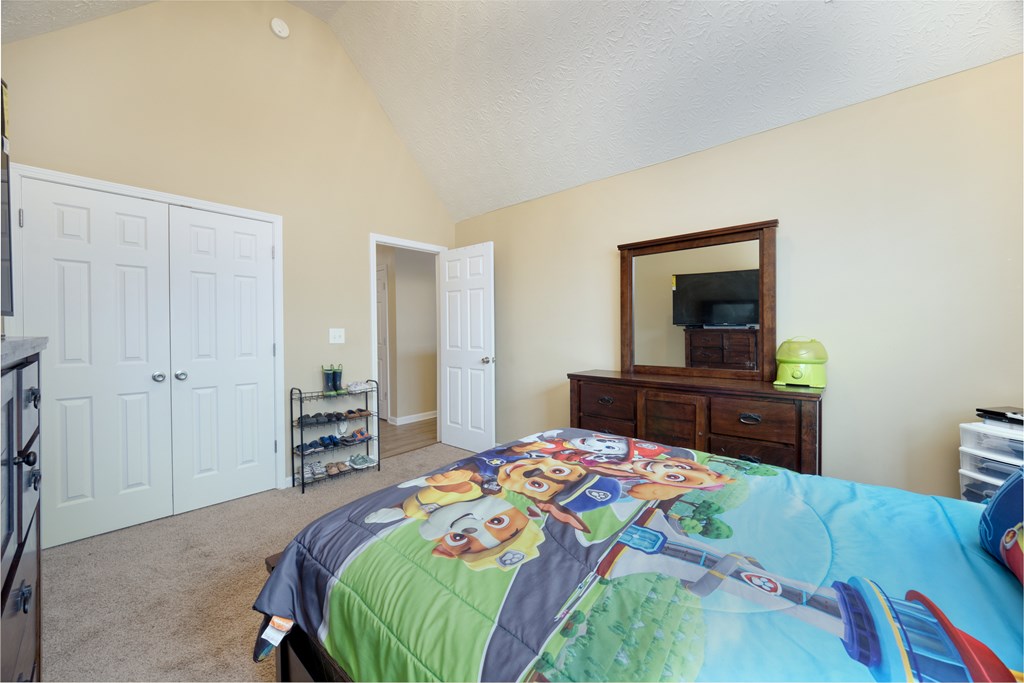 43 Ottawa Trail Fort Mitchell, AL 36856 - Photo 43 of 57 a bedroom with a bed and a flat screen tv