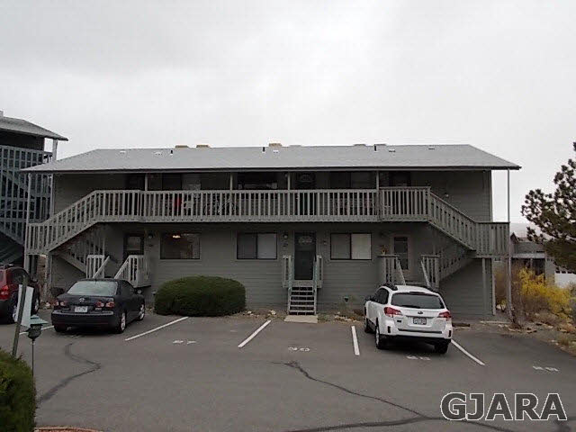 406 Ridges Boulevard, Unit 30 Grand Junction, CO 81507 - Photo 1 of 11 a car parked in front of a house
