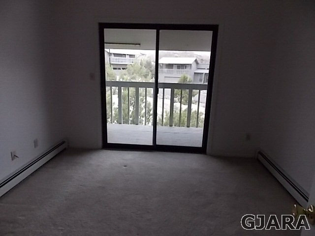 406 Ridges Boulevard, Unit 30 Grand Junction, CO 81507 - Photo 7 of 11 a view of an empty room with a window