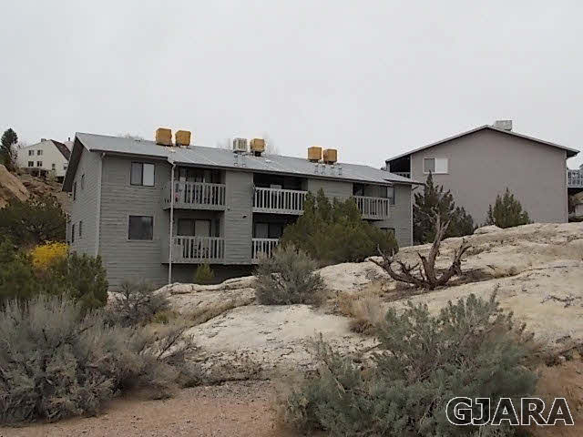 406 Ridges Boulevard, Unit 30 Grand Junction, CO 81507 - Photo 9 of 11 a view of a house with a wooden fence