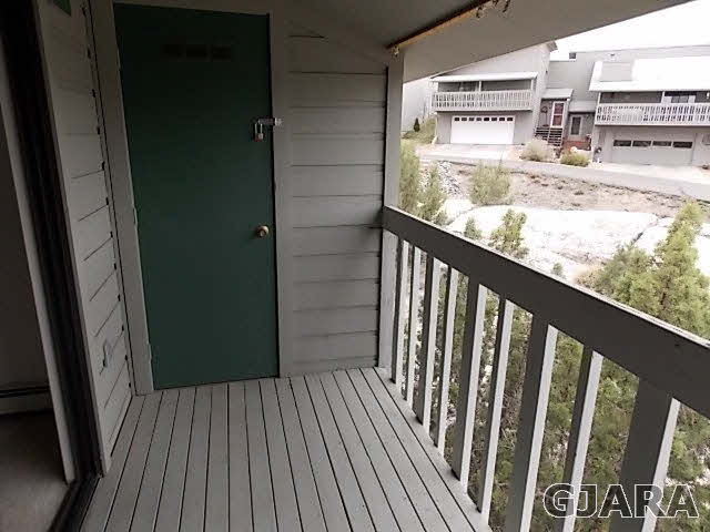 406 Ridges Boulevard, Unit 30 Grand Junction, CO 81507 - Photo 10 of 11 a view of a balcony with wooden floor