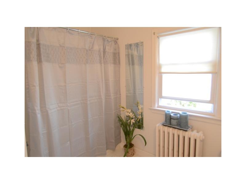 45 Sheep Hill Road Riverside, CT 06878 - Photo 11 of 15 a bathroom with a sink a bathtub and a window