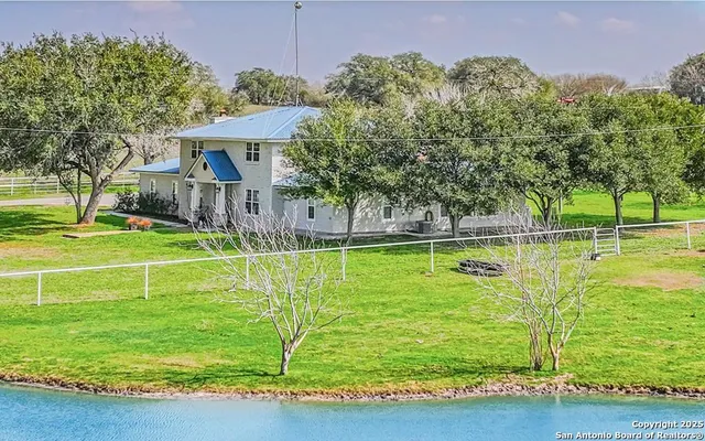 a view of a house with a big yard