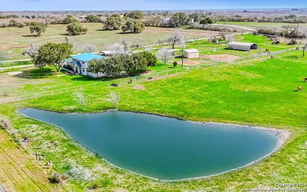 a view of a lake with a yard and lake view