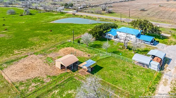 an aerial view of residential houses with outdoor space