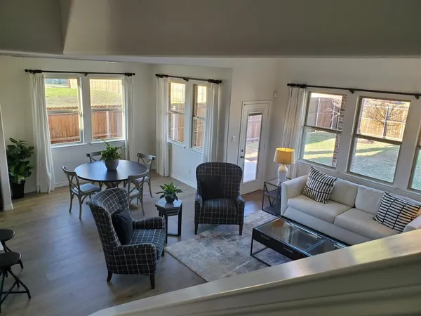 a living room with furniture and a large window