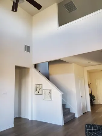 a view of a hallway with windows