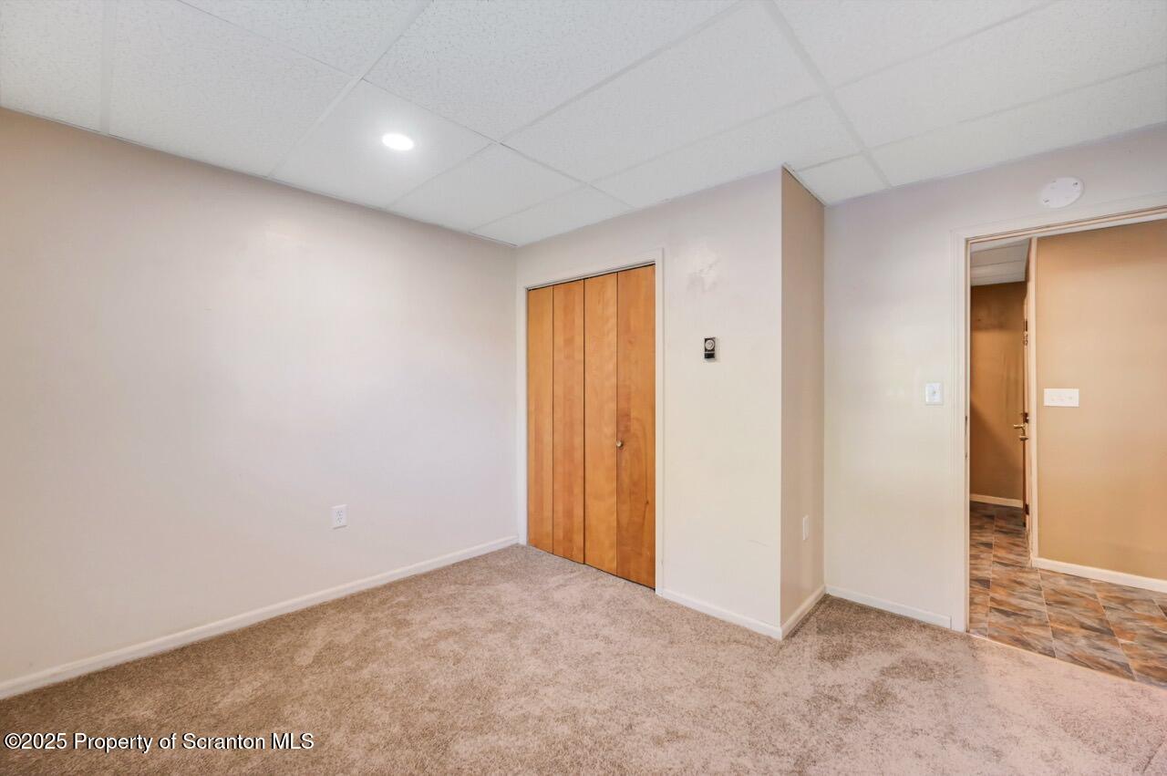 601 Dean Street Scranton, PA 18509 - Photo 12 of 58 an empty room with windows