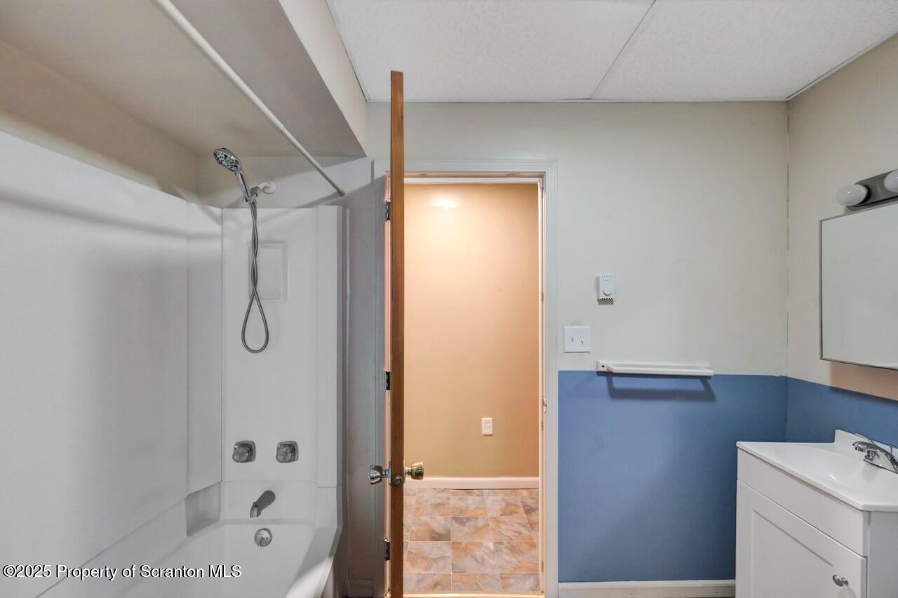 601 Dean Street Scranton, PA 18509 - Photo 22 of 58 a bathroom with a shower and a sink