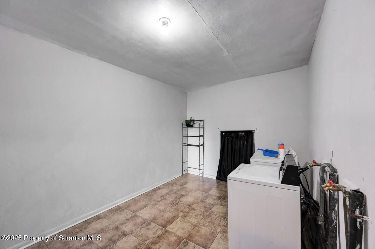 601 Dean Street Scranton, PA 18509 - Photo 25 of 58 a view of a storage & utility room with washer and dryer