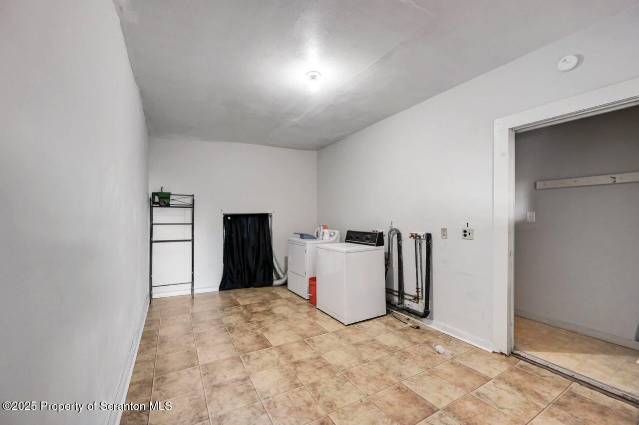 601 Dean Street Scranton, PA 18509 - Photo 27 of 58 a view of a livingroom with closet and cabinet