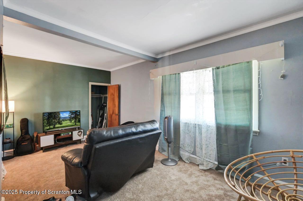 601 Dean Street Scranton, PA 18509 - Photo 29 of 58 a living room with furniture and a flat screen tv