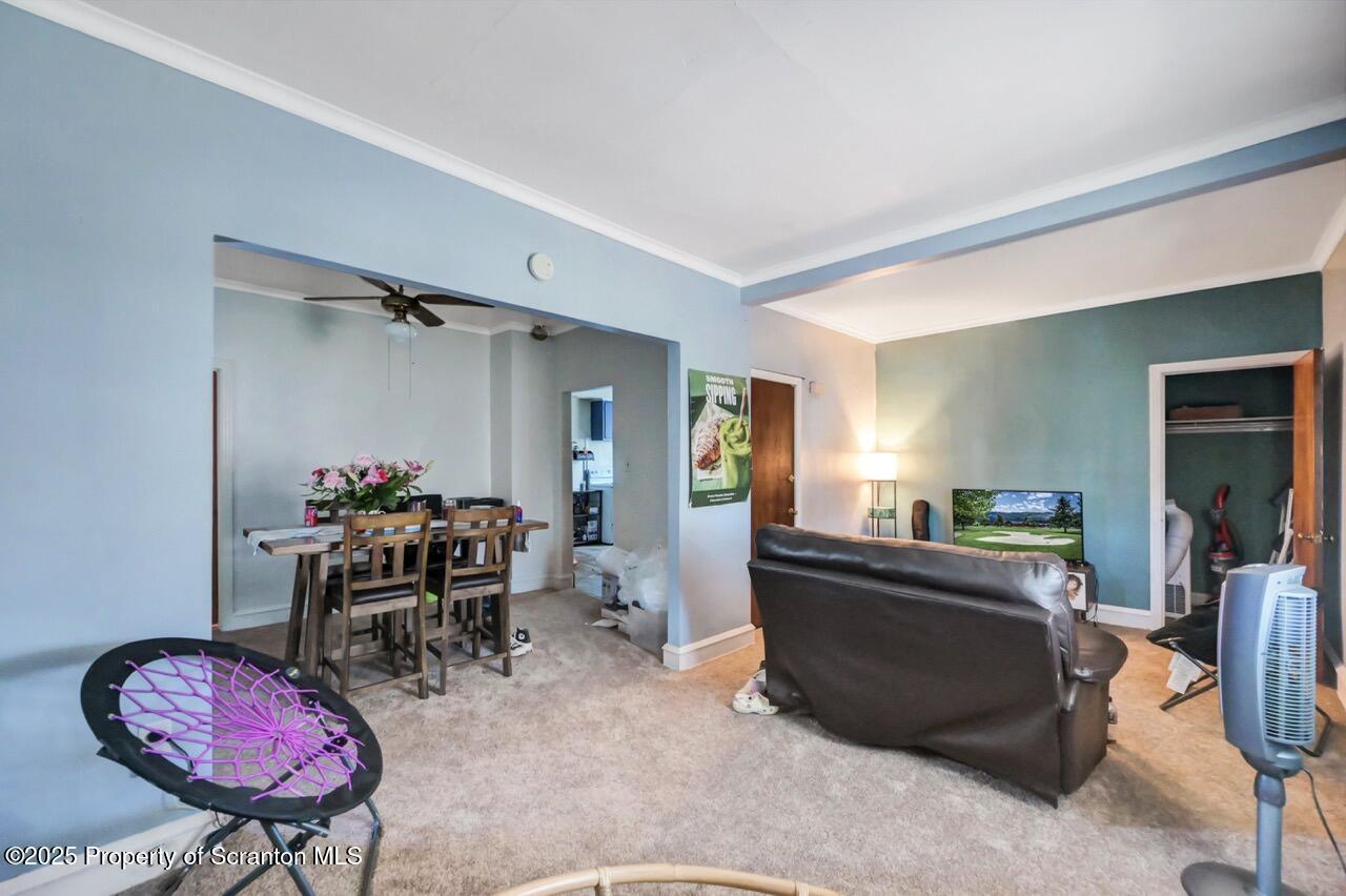 601 Dean Street Scranton, PA 18509 - Photo 30 of 58 a bedroom with furniture and a chair