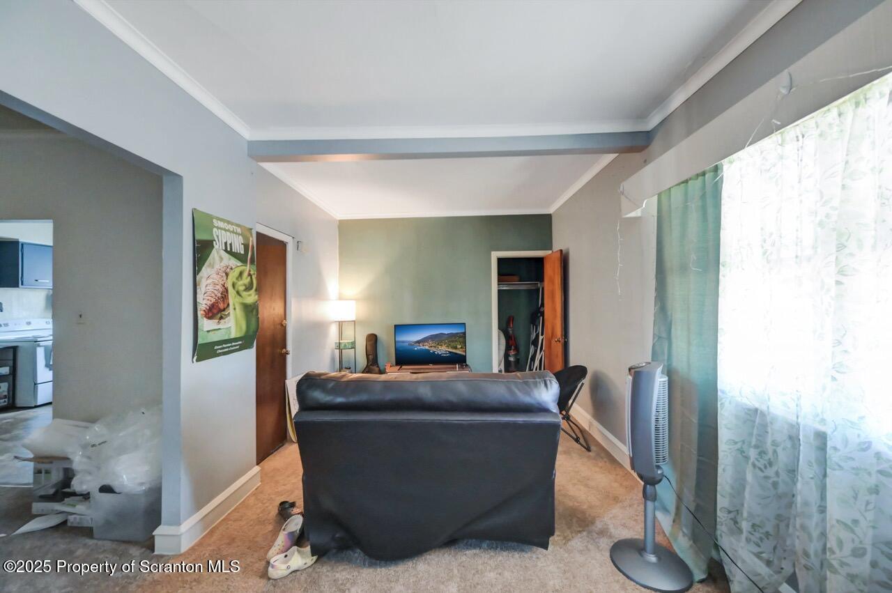 601 Dean Street Scranton, PA 18509 - Photo 31 of 58 a room with furniture and window