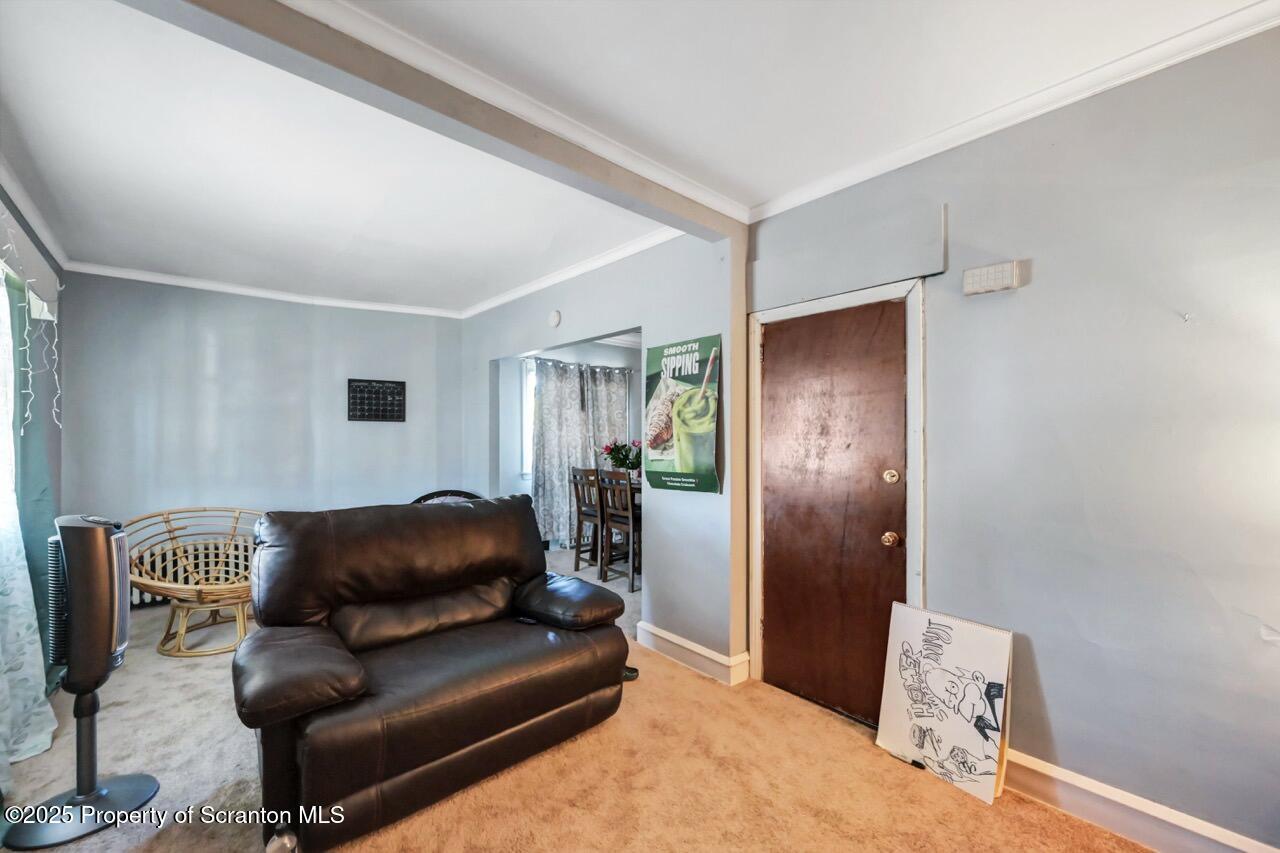 601 Dean Street Scranton, PA 18509 - Photo 32 of 58 a living room with furniture and a window