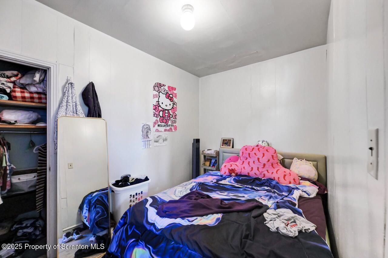 601 Dean Street Scranton, PA 18509 - Photo 35 of 58 a bedroom with a bed and a closet