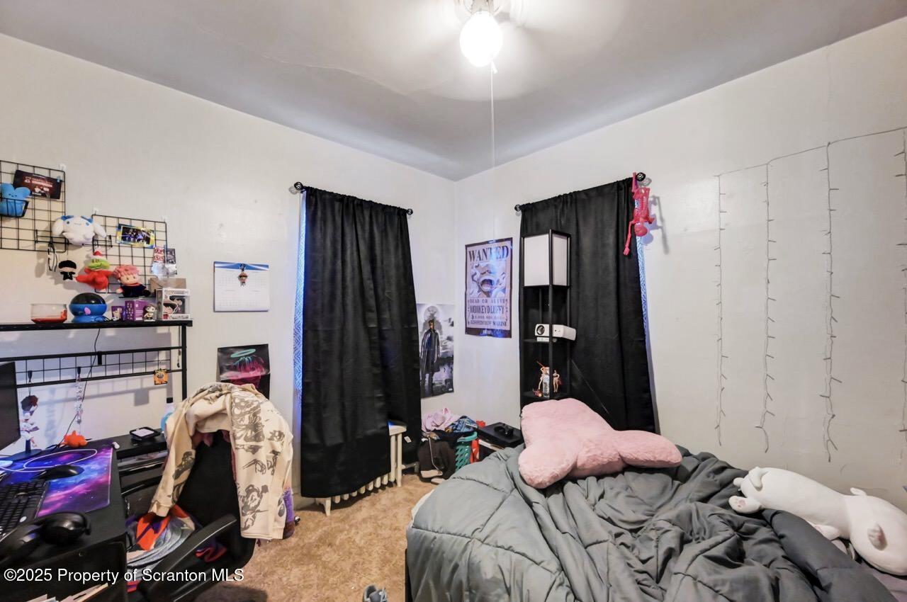 601 Dean Street Scranton, PA 18509 - Photo 42 of 58 a bedroom with bed and a closet