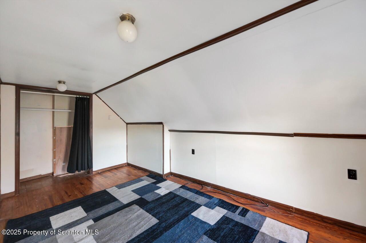601 Dean Street Scranton, PA 18509 - Photo 45 of 58 a room with wooden floor and natural light