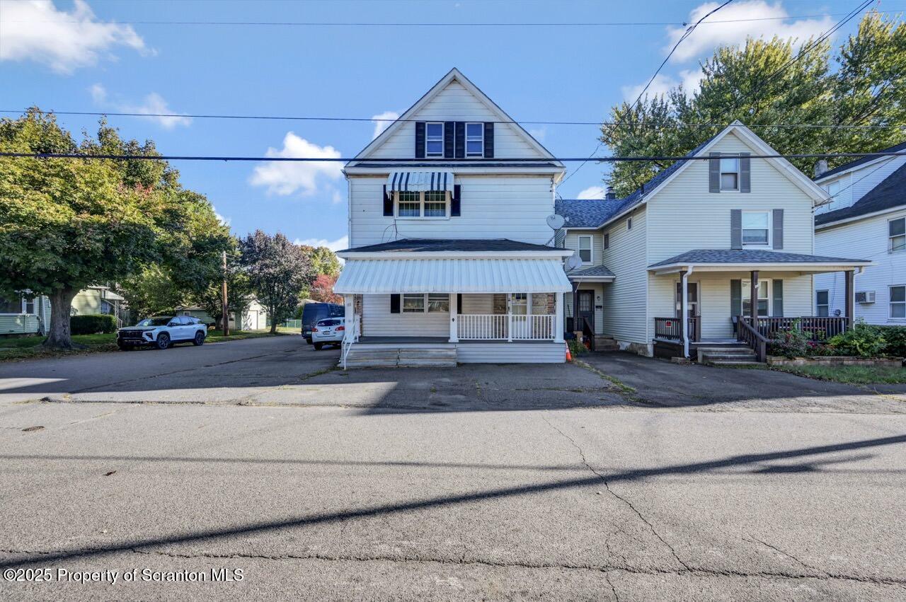 601 Dean Street Scranton, PA 18509 - Photo 55 of 58 a front view of a house with a yard