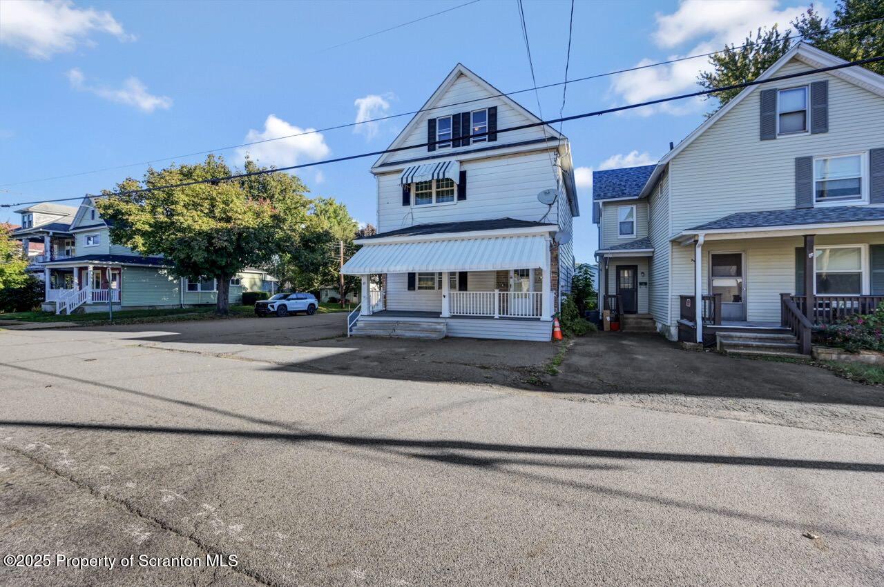 601 Dean Street Scranton, PA 18509 - Photo 56 of 58 a front view of a house with a yard