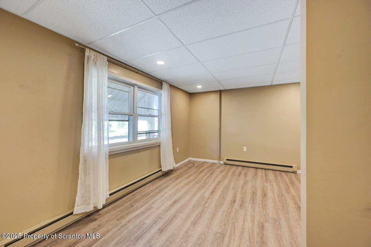 601 Dean Street Scranton, PA 18509 - Photo 6 of 58 a view of an empty room with a window