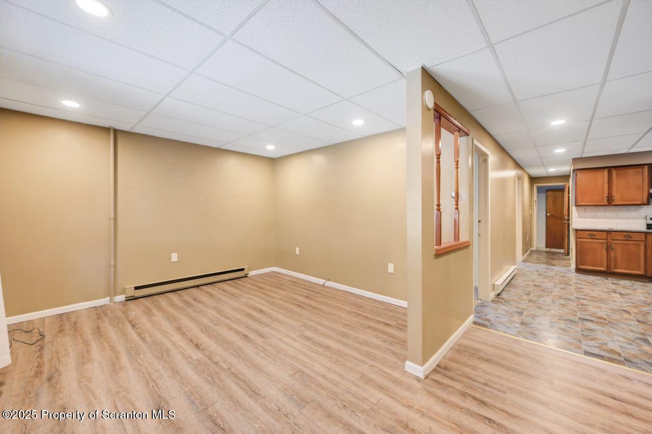 601 Dean Street Scranton, PA 18509 - Photo 7 of 58 a view of an empty room with wooden floor