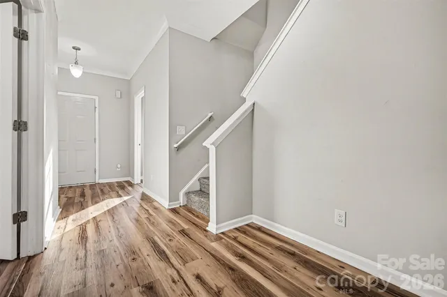 a view of entryway with wooden floor