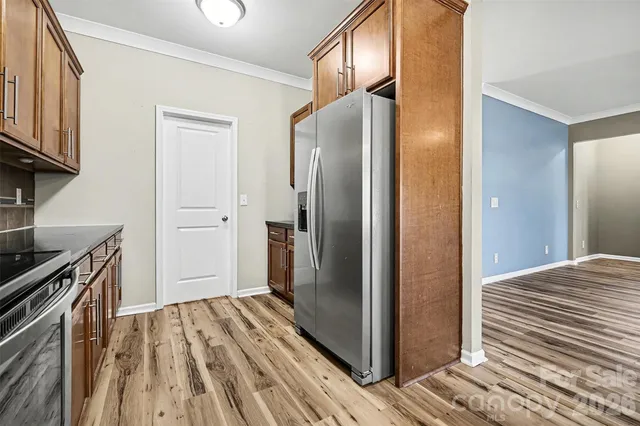 a view of a kitchen from the hallway