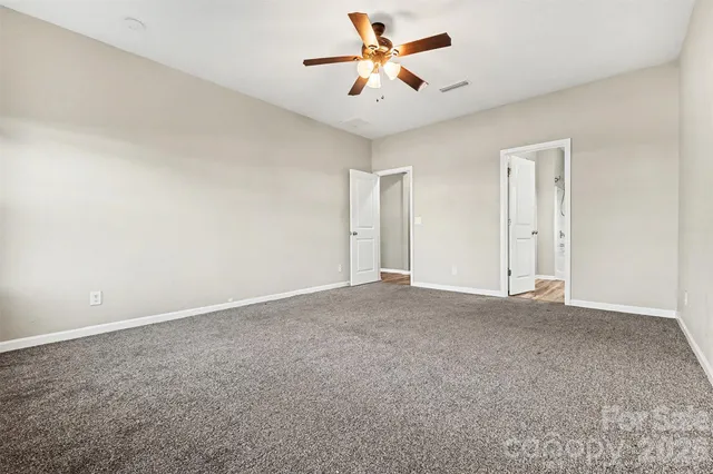 a view of a big room with carpet