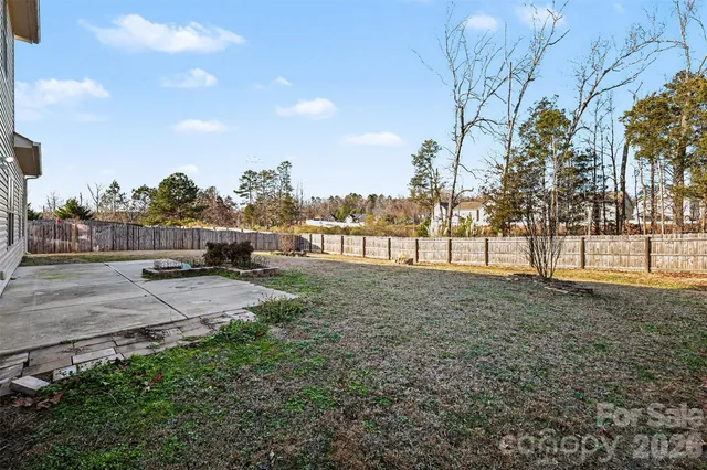 a view of outdoor space with playground and green space