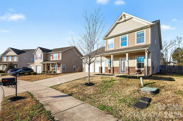 a front view of a house with garden