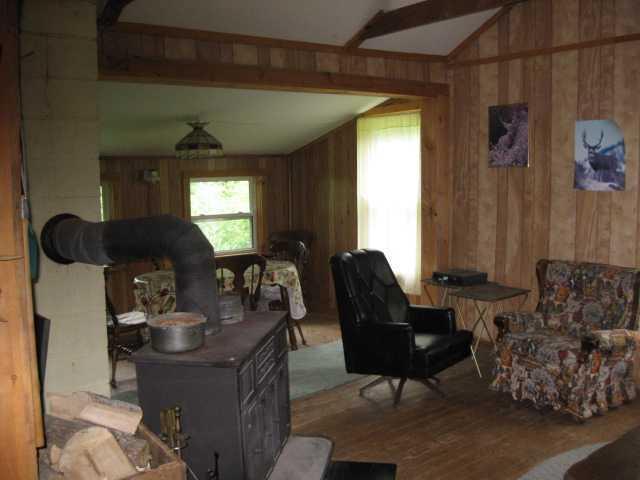 945 Parmenter Road Palermo, ME 04354 - Photo 3 of 7 Dining Room. Dining Room and woodstove