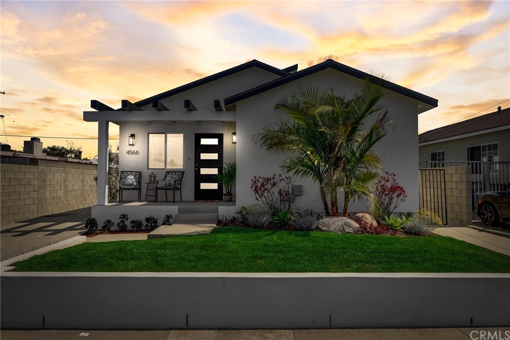 4566 166th Street Lawndale, CA 90260 - Photo 2 of 64 a front view of a house with garden