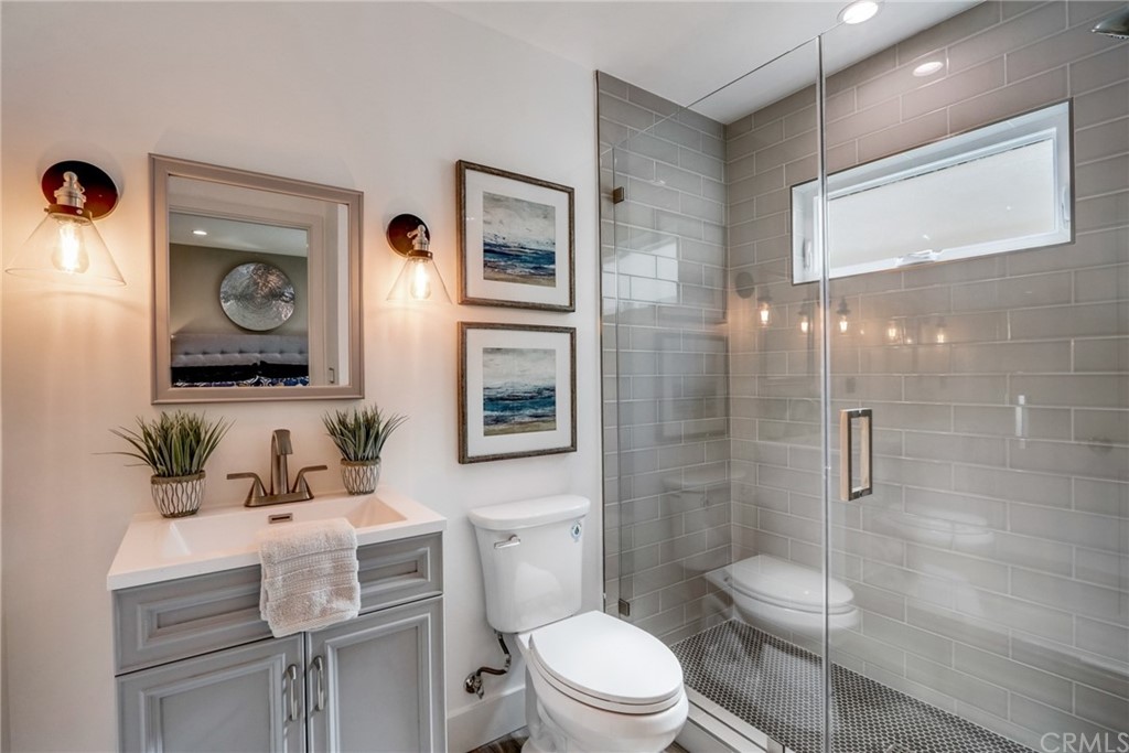 4566 166th Street Lawndale, CA 90260 - Photo 24 of 64 a bathroom with a toilet a sink and shower