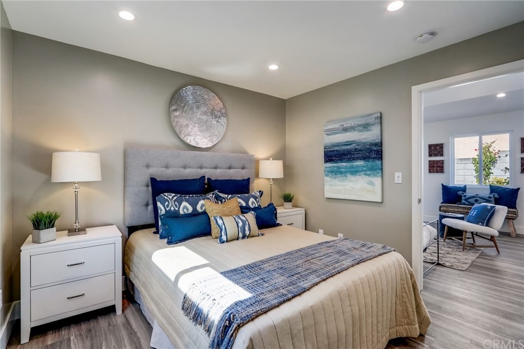 4566 166th Street Lawndale, CA 90260 - Photo 25 of 64 a bedroom with a bed and a chandelier