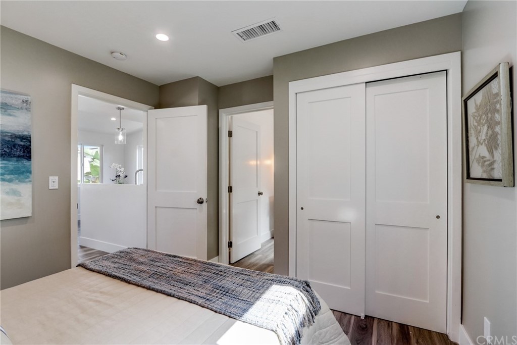 4566 166th Street Lawndale, CA 90260 - Photo 27 of 64 a bedroom with a bed and a mirror