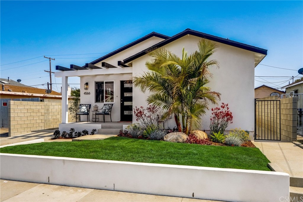 4566 166th Street Lawndale, CA 90260 - Photo 3 of 64 a front view of a house with a yard and garage