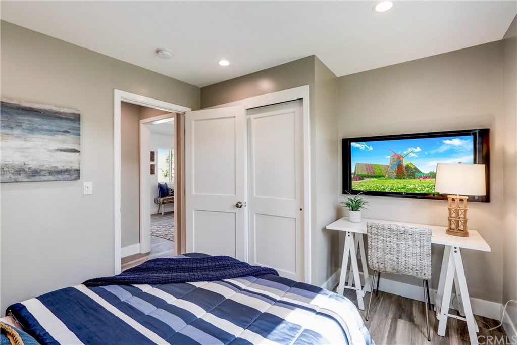 4566 166th Street Lawndale, CA 90260 - Photo 32 of 64 a bedroom with a bed and a flat screen tv