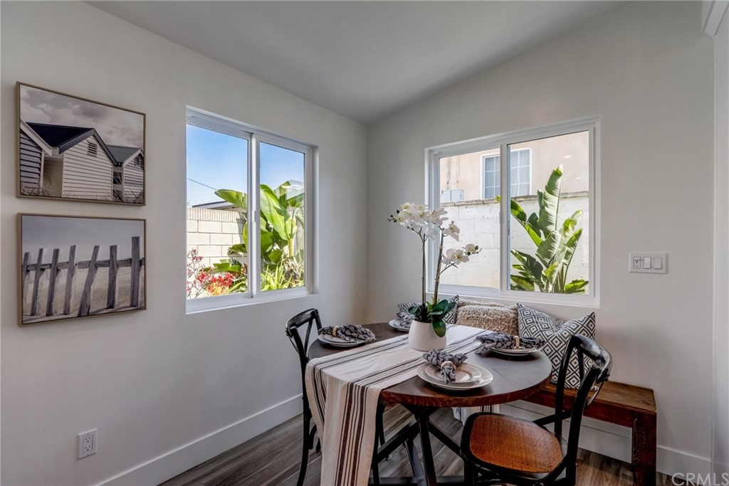 4566 166th Street Lawndale, CA 90260 - Photo 35 of 64 a view of a dining room with furniture a rug and wooden floor