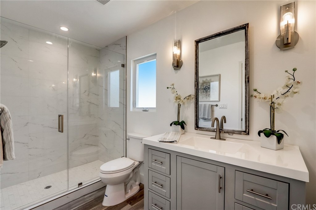 4566 166th Street Lawndale, CA 90260 - Photo 37 of 64 a bathroom with a sink a toilet and shower