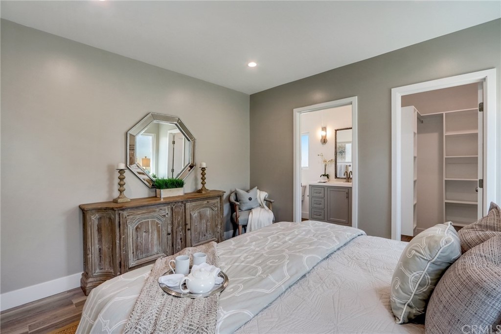 4566 166th Street Lawndale, CA 90260 - Photo 39 of 64 a bedroom with a bed table and mirror