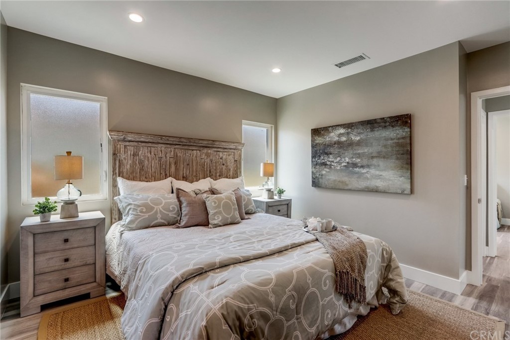 4566 166th Street Lawndale, CA 90260 - Photo 40 of 64 a bedroom with a bed and a painting on the wall