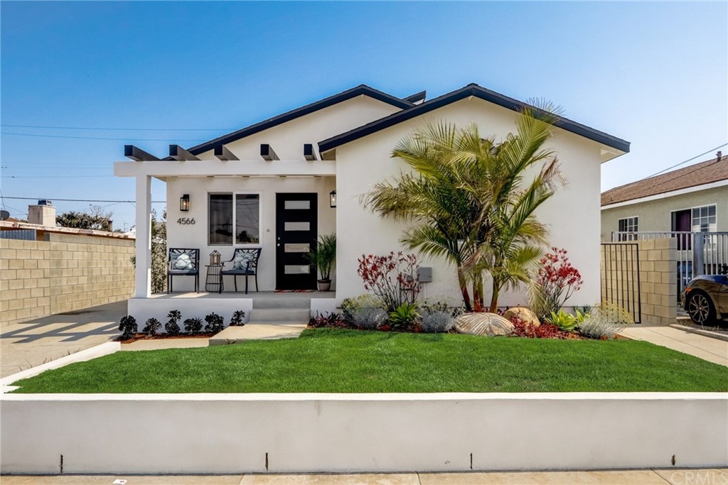 4566 166th Street Lawndale, CA 90260 - Photo 4 of 64 a front view of a house with a yard